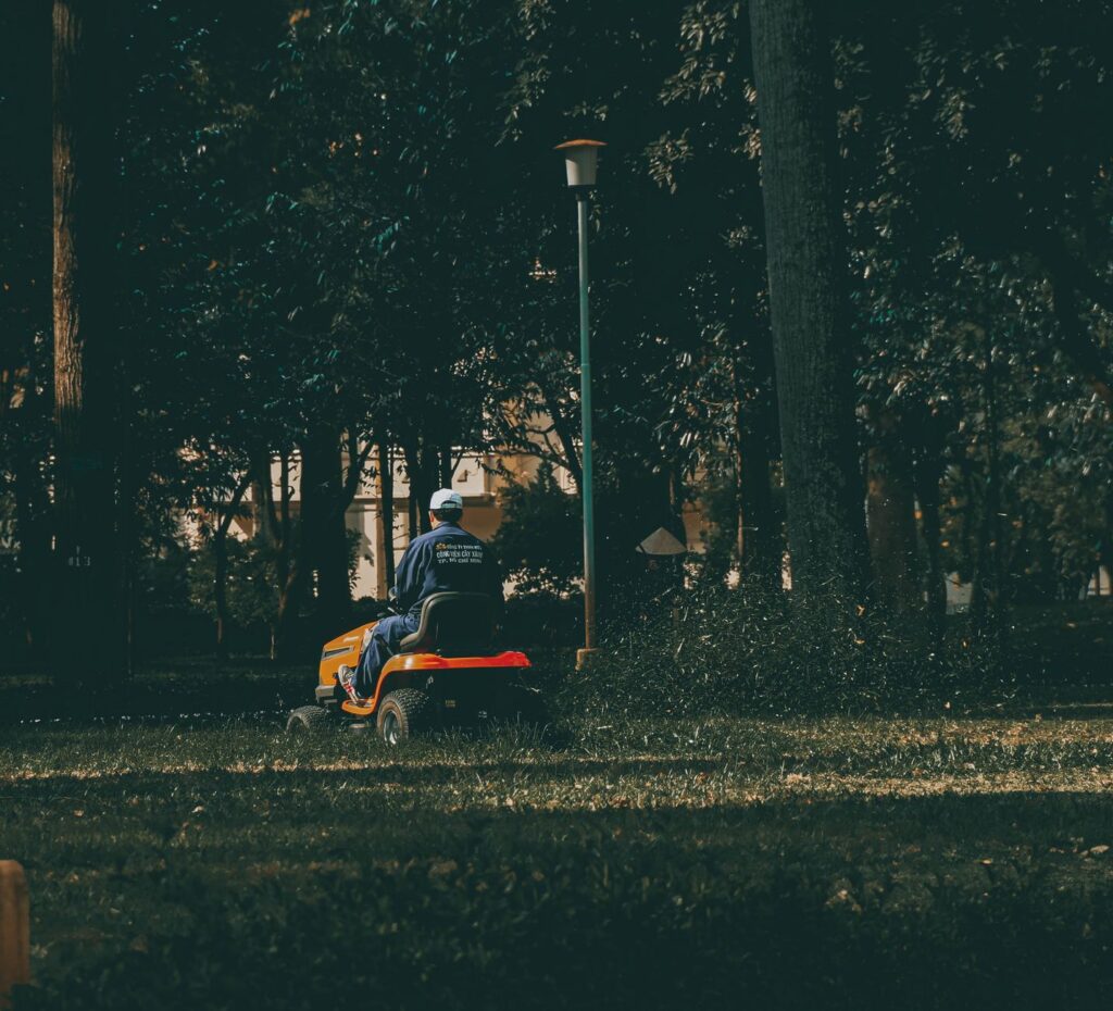 Finding Trusted Lawn Mowing Companies Near Me in Ocala 1 technician operating a mower for a lawn mowing companies near me search result in Ocala FL