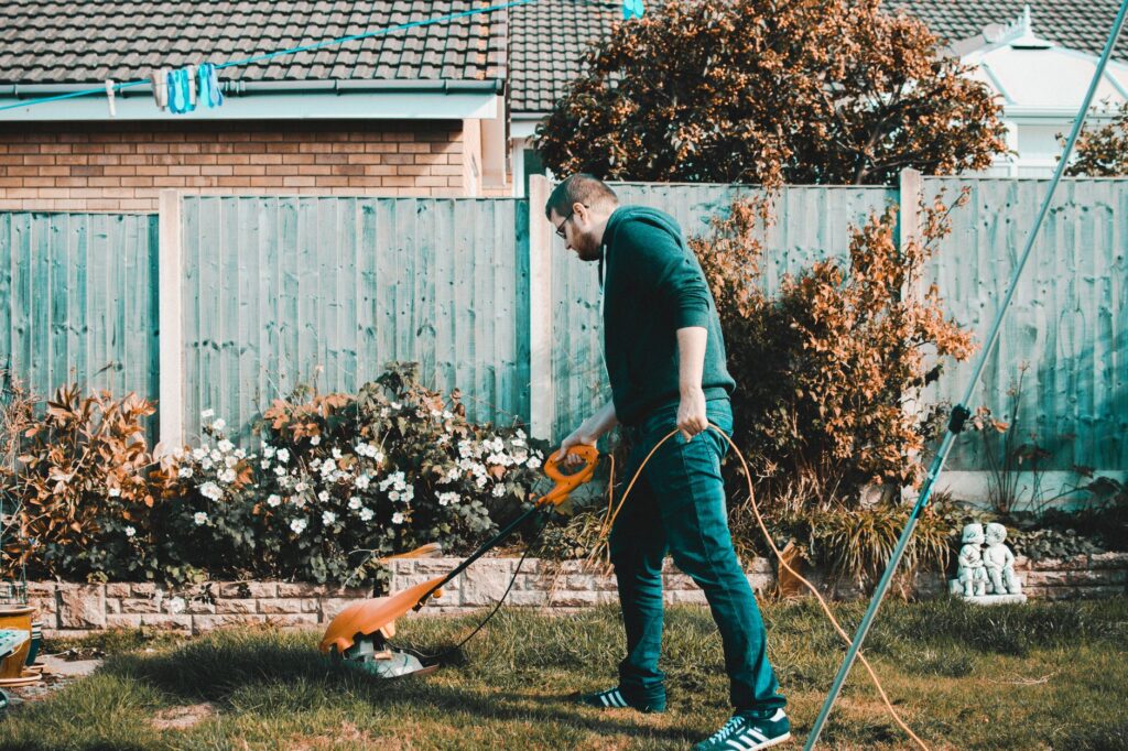 2026 Guide to Lawn Care Services Silver Springs Homeowners Trust 1 technician mowing a residential lawn during lawn care services Silver Springs visit