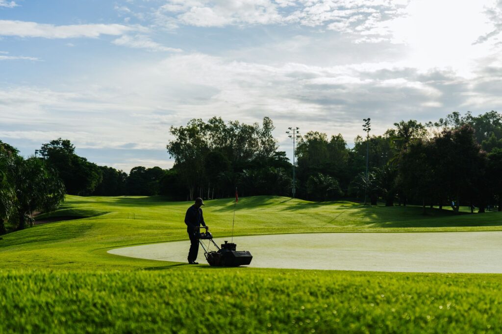 Finding Reliable Lawn Services Near Me in Ocala, FL (2026 Guide) 1 technician mowing a residential lawn while searching lawn services near me results