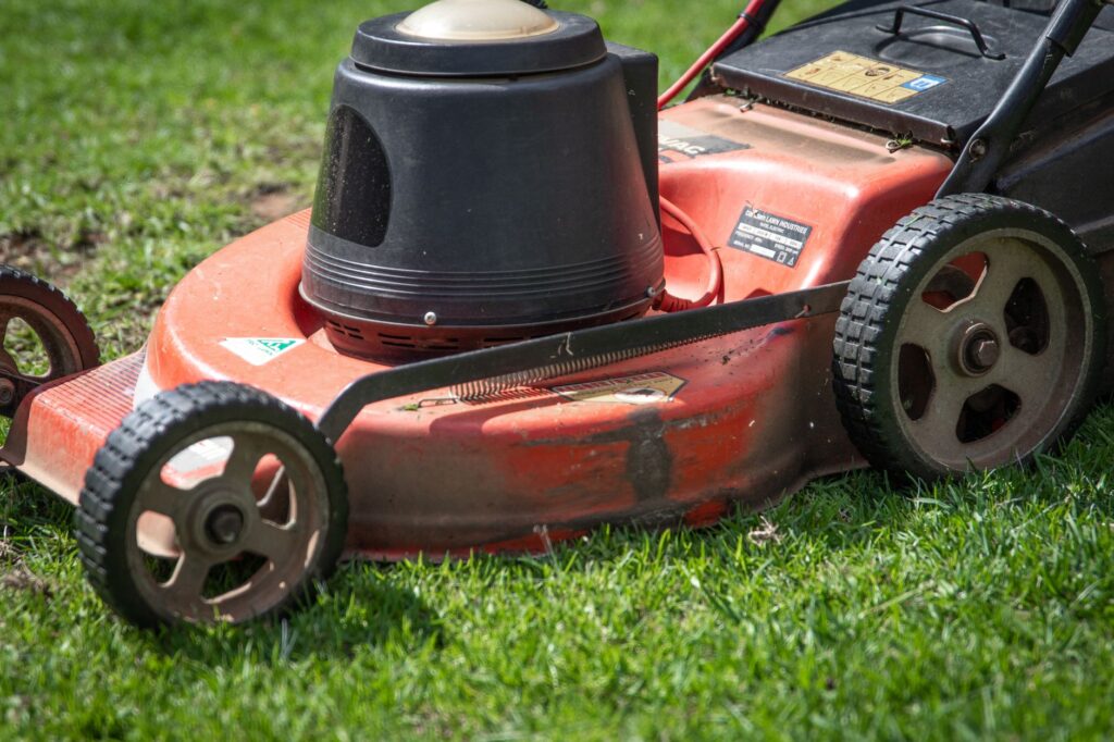 Ocala's Best Grass Cutting Service Near Me: What Homeowners Need to Know 2 comparison of a DIY push mower versus a commercial mowing crew truck