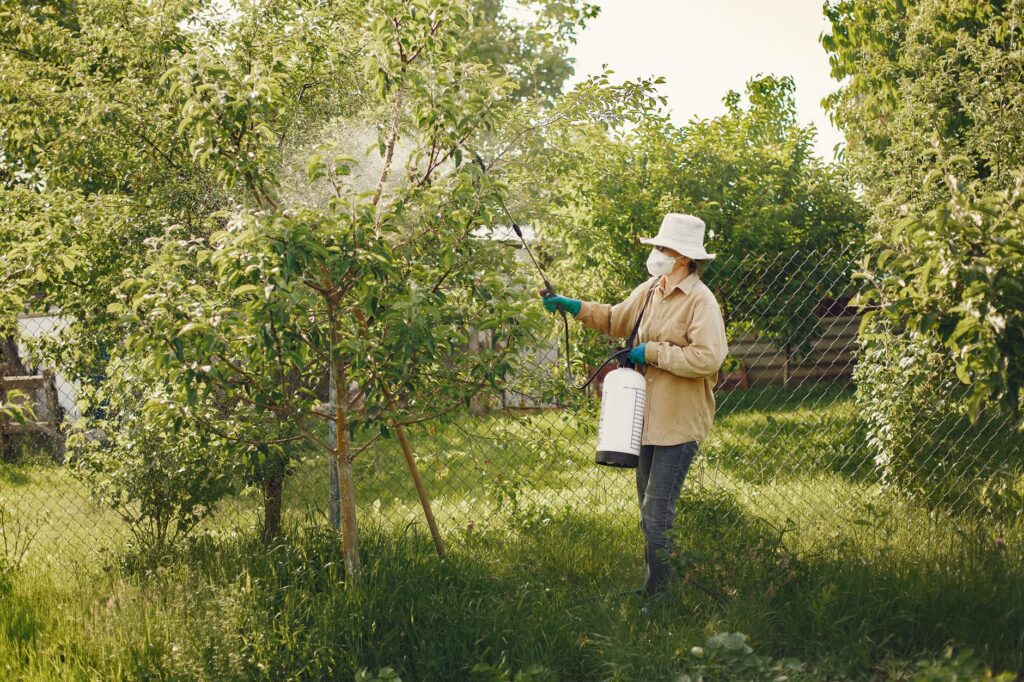 2026 Guide to Lawn Care Services Silver Springs Homeowners Trust 2 fertilization technician treating a Marion County lawn