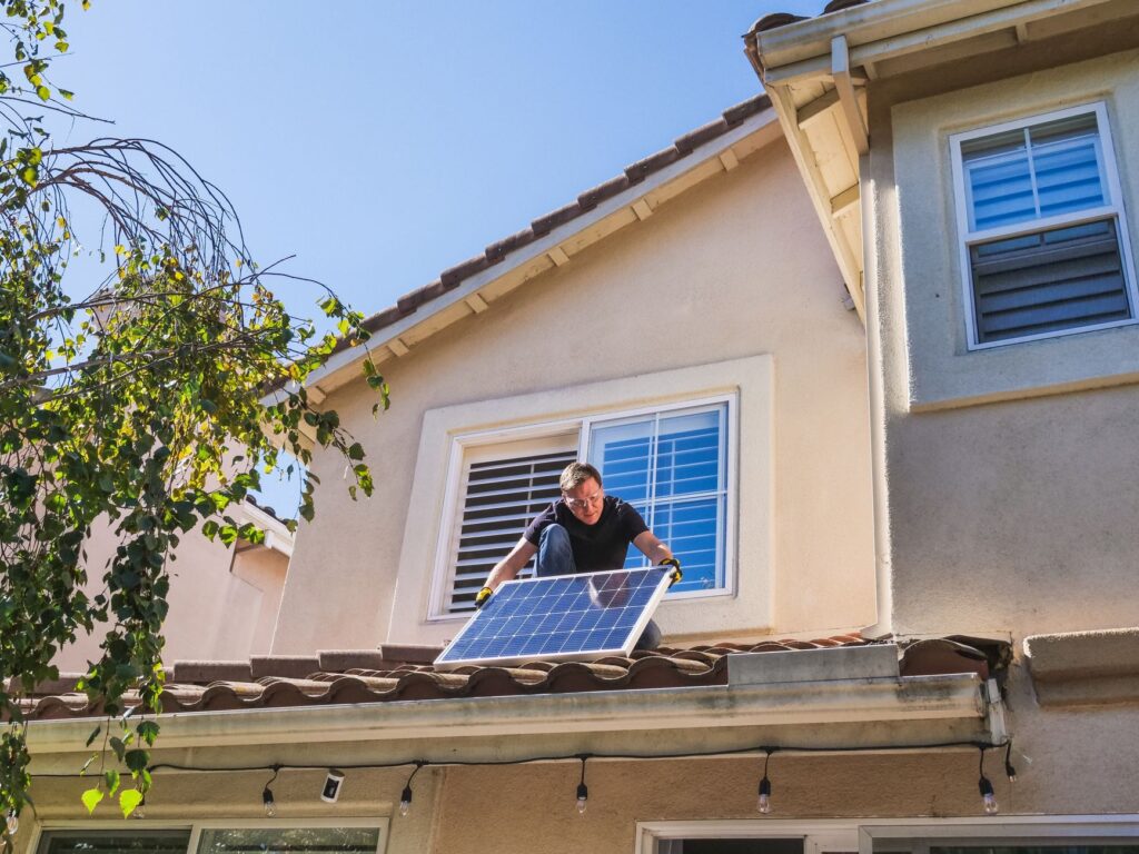 technician performing solar panel cleaning marion county residential rooftop