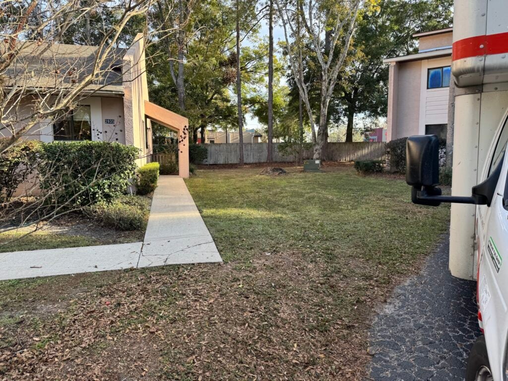affordable lawn mowing companies near me service truck parked in an Ocala neighborhood